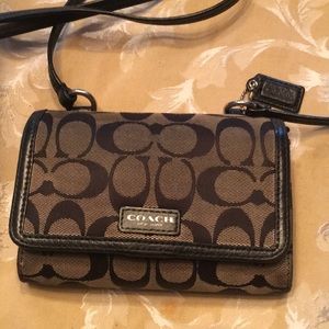 Signature Coach wallet with crossbody strap